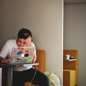 Photo of a student studying with his laptop in a study carel.