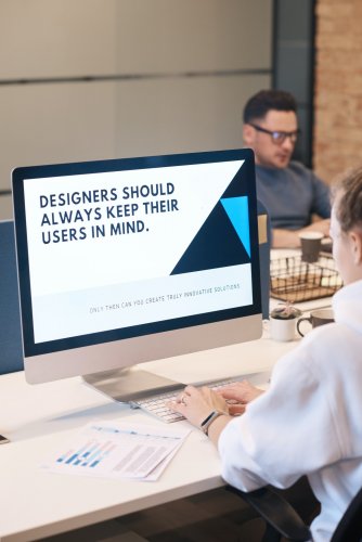 Photo of a women using a desktop computer, with the screen showing the words "Designers should always keep their users in mind"